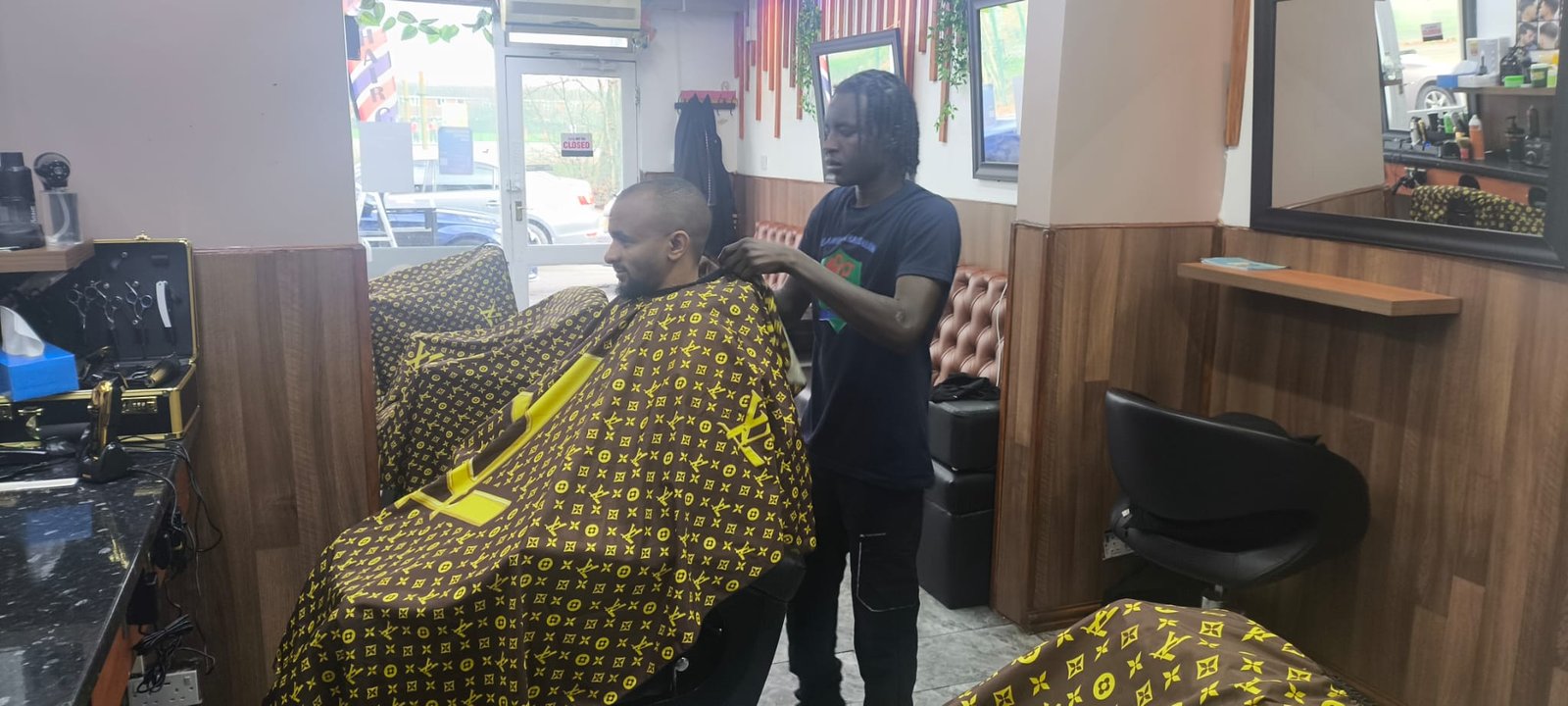 Barber at work, Selam Unisex Hair Salon Manchester