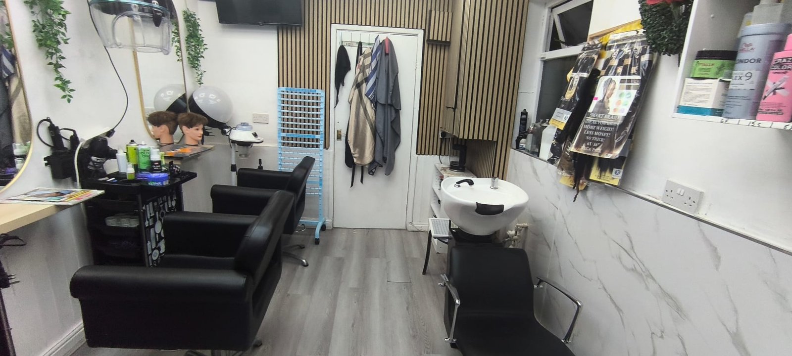 Selam Unisex Hair Salon hair studio interior — clean styling stations with professional equipment